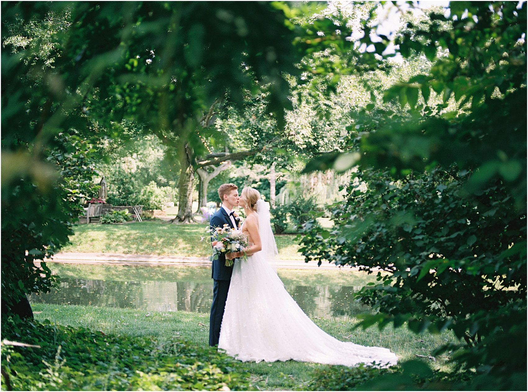 Mary Claire and Jack kiss in the garden at Saint Marys College on their wedding day photo by Cynthia Mae Photography Notre Dame Wedding Photographer