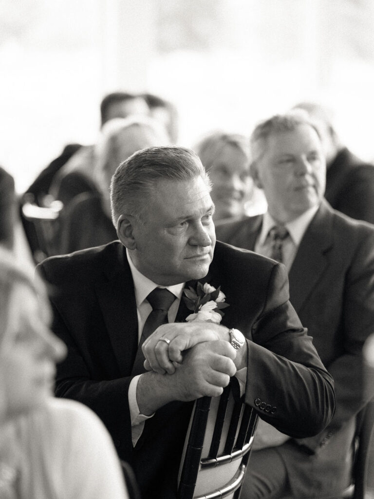 Father of the bride listening to speeches