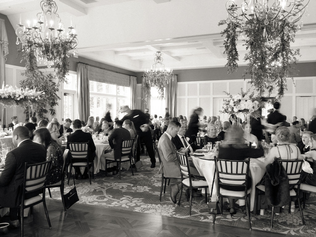 Guests having dinner during a Cascade Hills Country Club in Grand Rapids, Michigan wedding reception