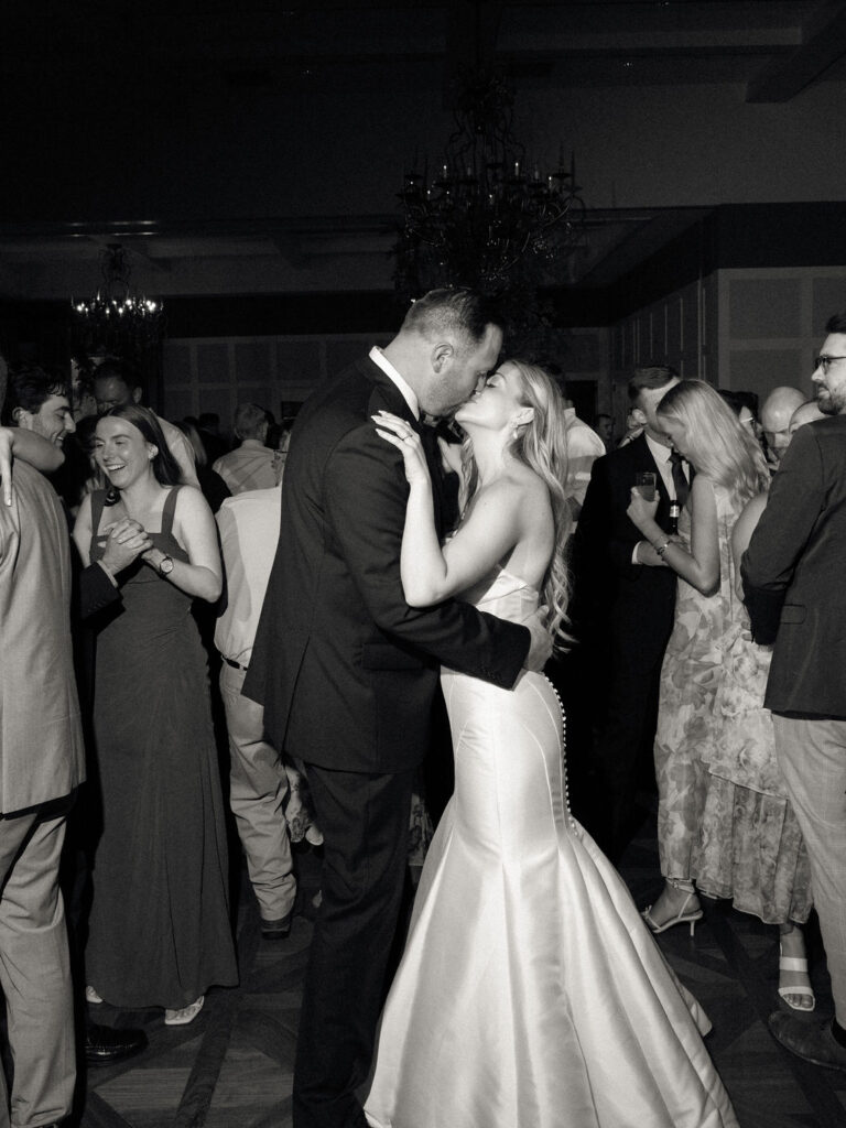 Bride and groom kissing during their Cascade Hills Country Club wedding in Grand Rapids, Michigan