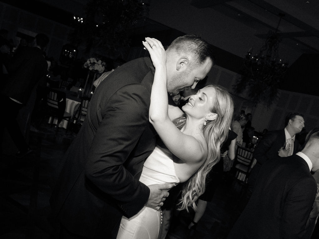 Bride and groom kissing during their Cascade Hills Country Club wedding in Grand Rapids, Michigan