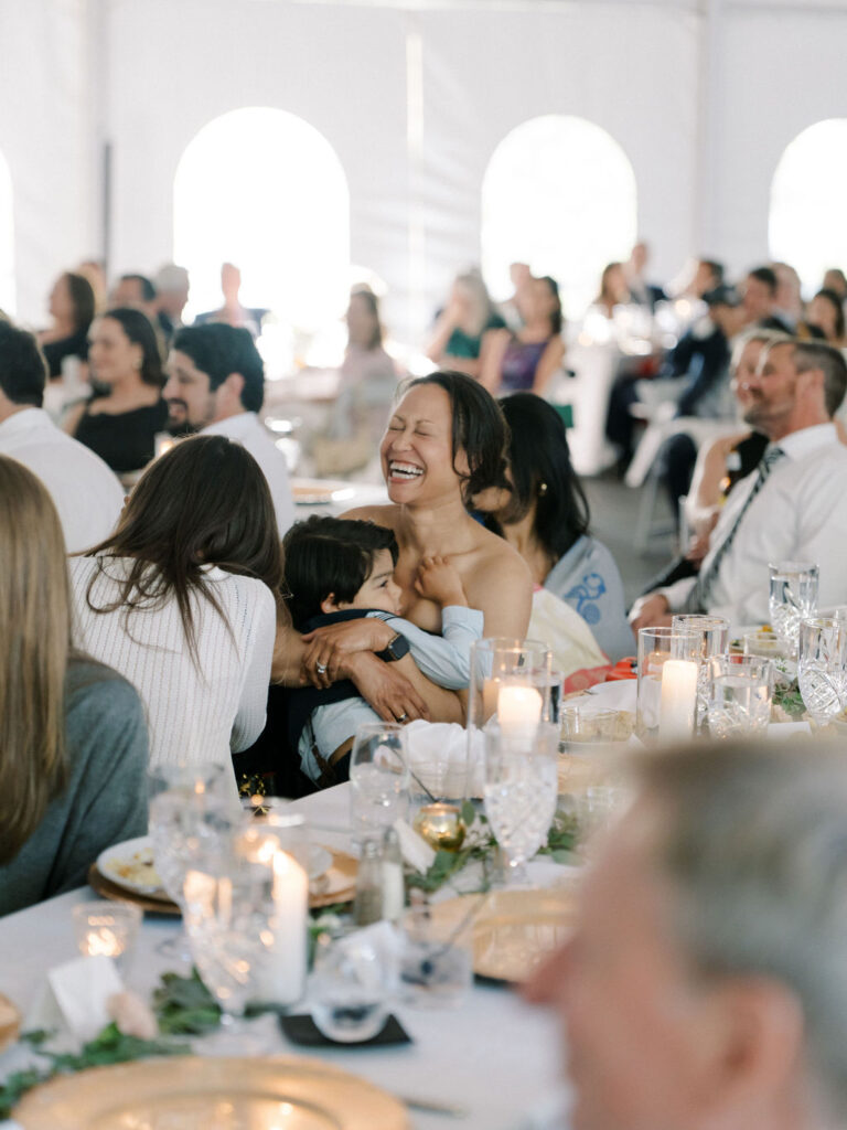 guests laughing during speeches