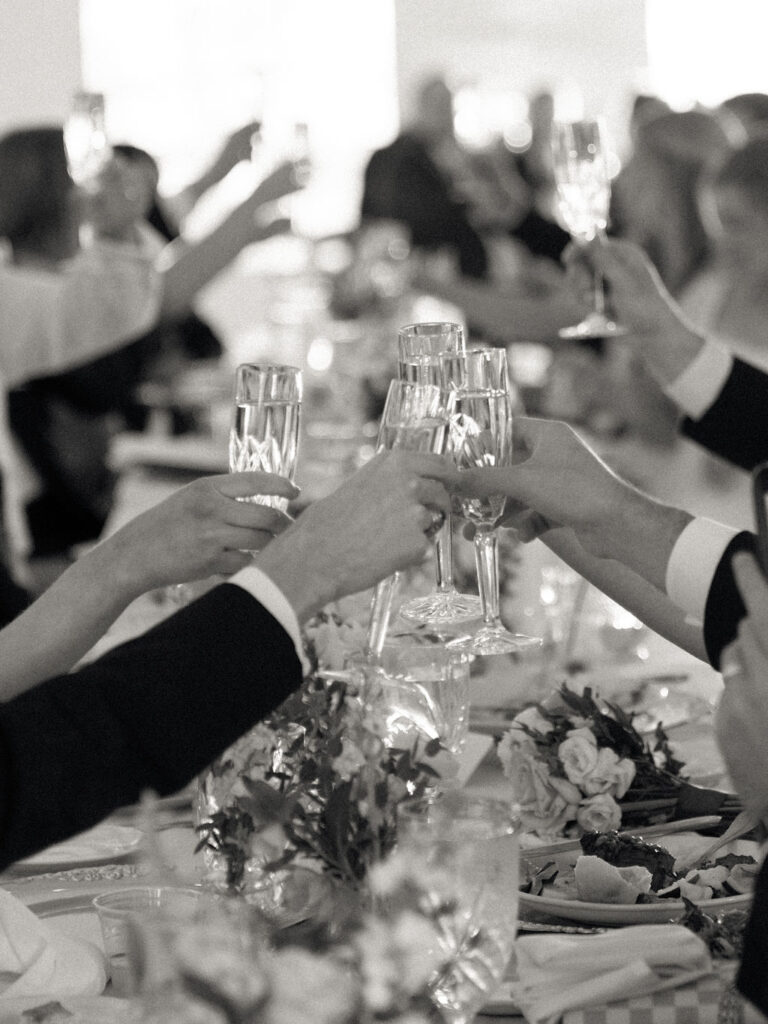 Guests toasting drink during speeches