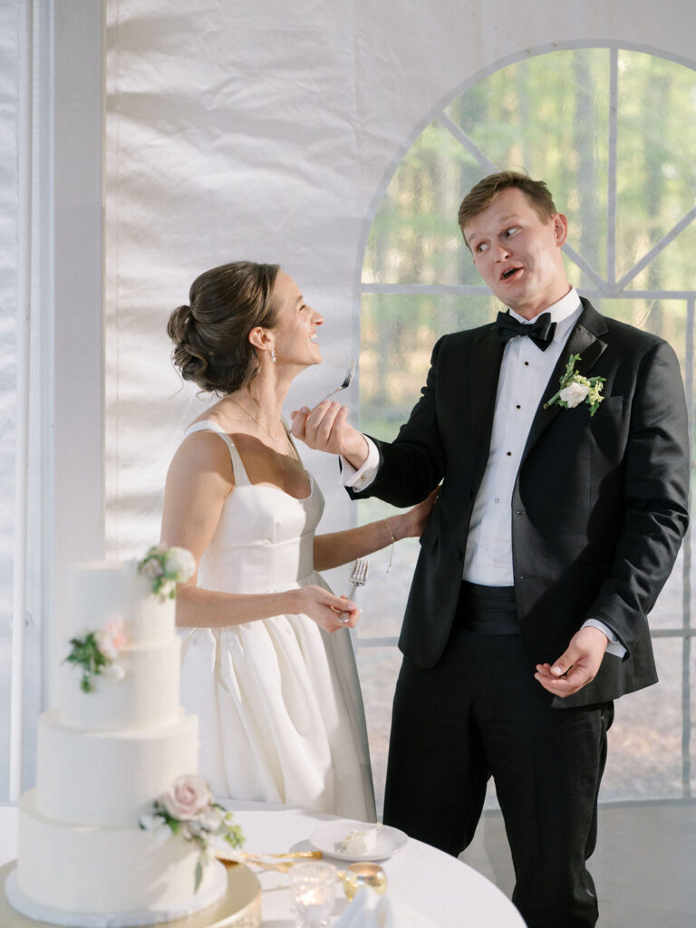 Bride and groom eating their wedding cake