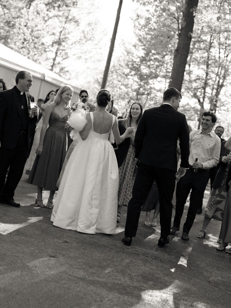 Bride and groom mingling with guests during cocktail hour