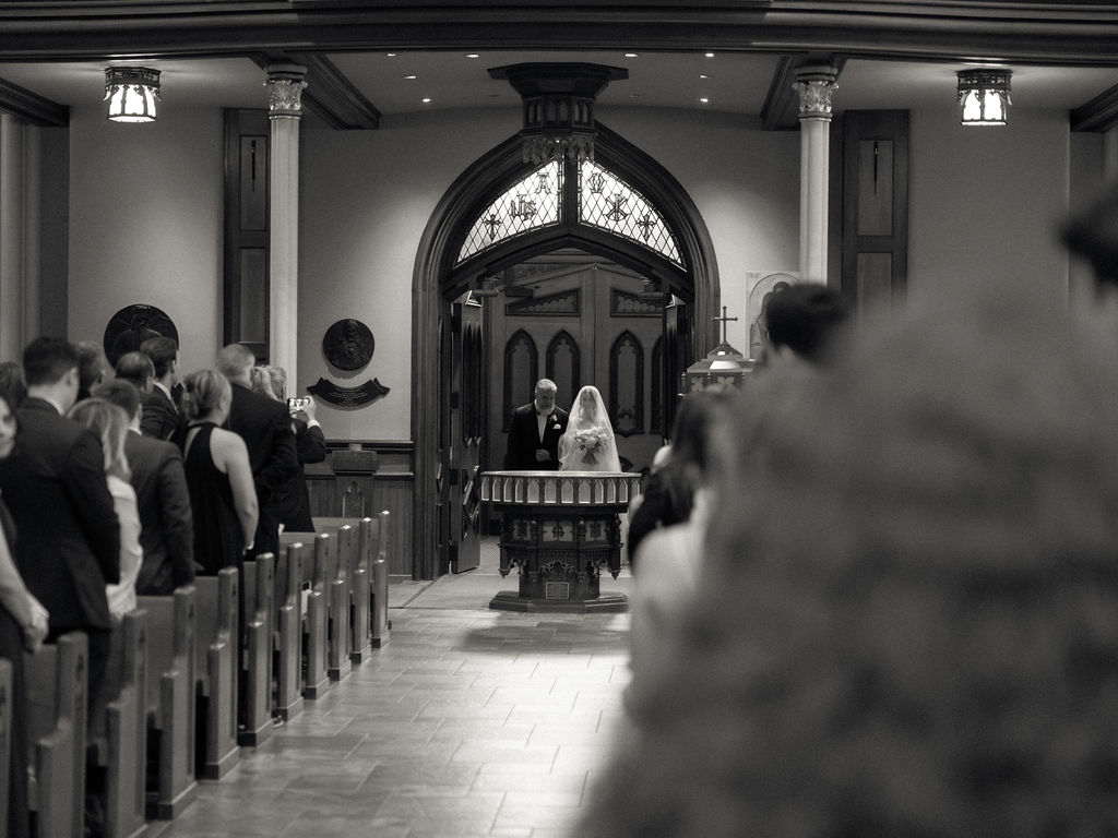 Bride as she's about to walk down the aisle with her father for her Notre Dame Basilica wedding ceremony