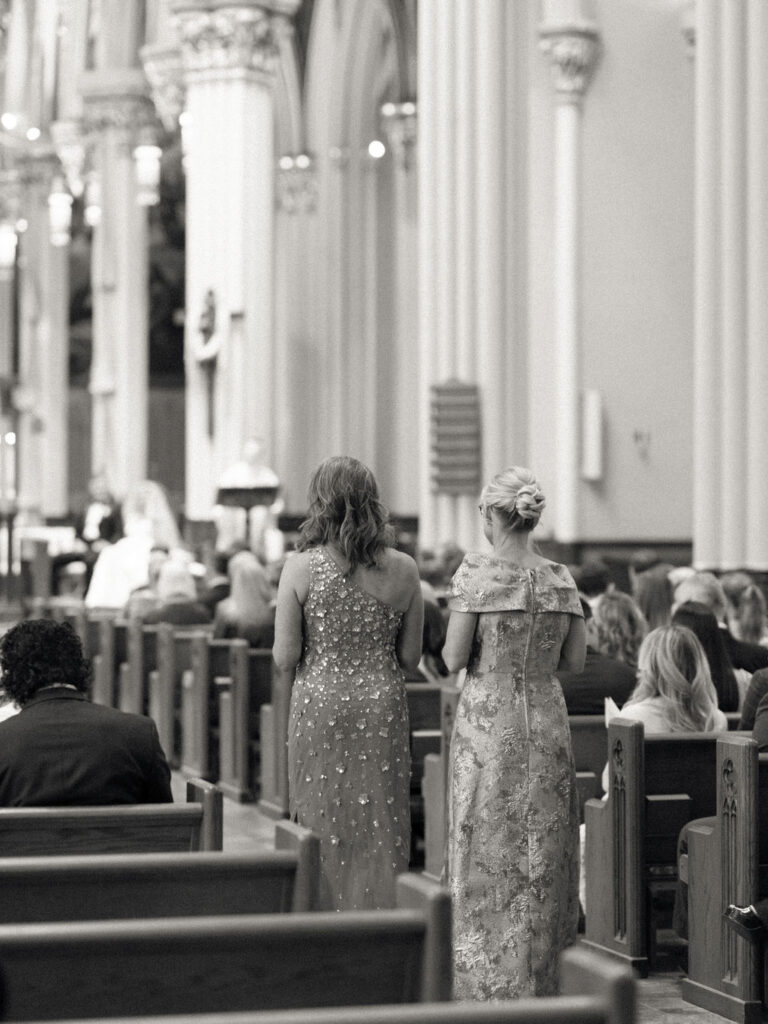 Mothers standing during a Notre Dame Basilica wedding ceremony