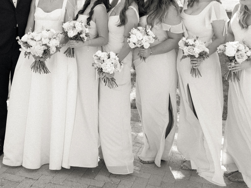 Close up shot of a bride standing next to her bridesmaids