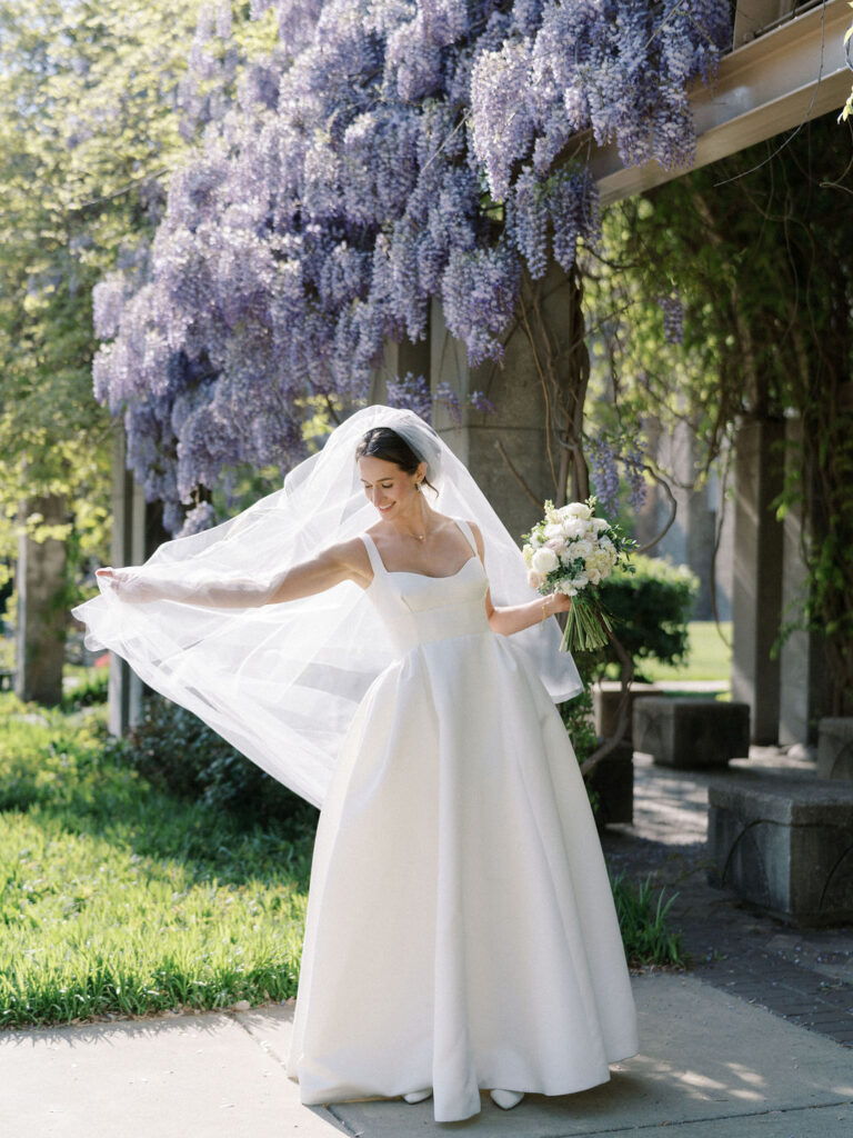 Bride posing outdoors for her Notre Dame wedding portraits