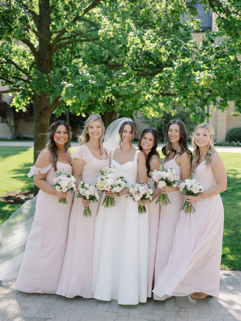 Outdoor bride and bridesmaids photo from a Notre Dame wedding