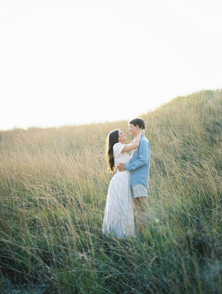 Couples film engagement photos at Warren Dunes State Park in Michigan