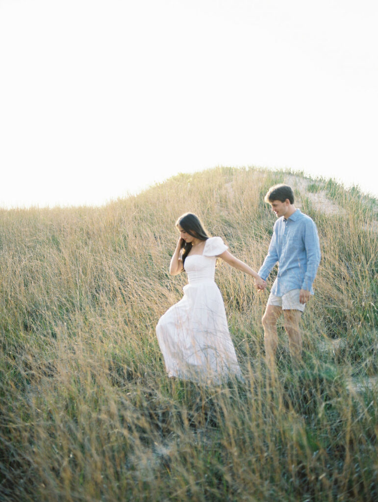 Couples film engagement photos at Warren Dunes State Park in Michigan