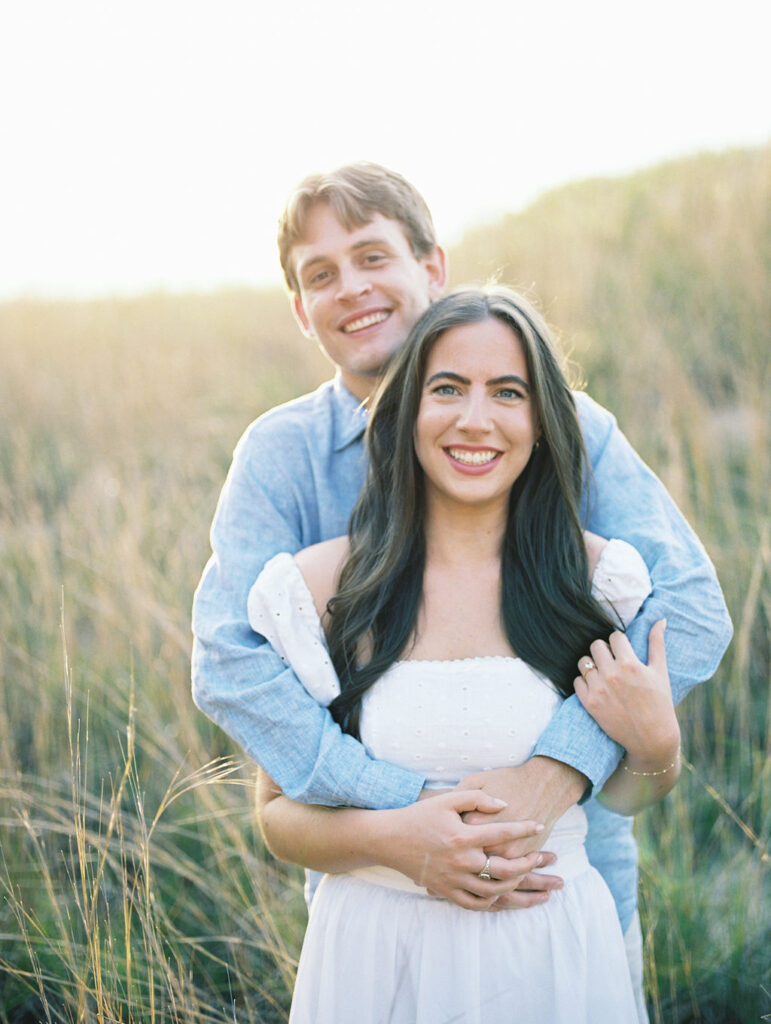 Couples film engagement photos at Warren Dunes State Park in Michigan