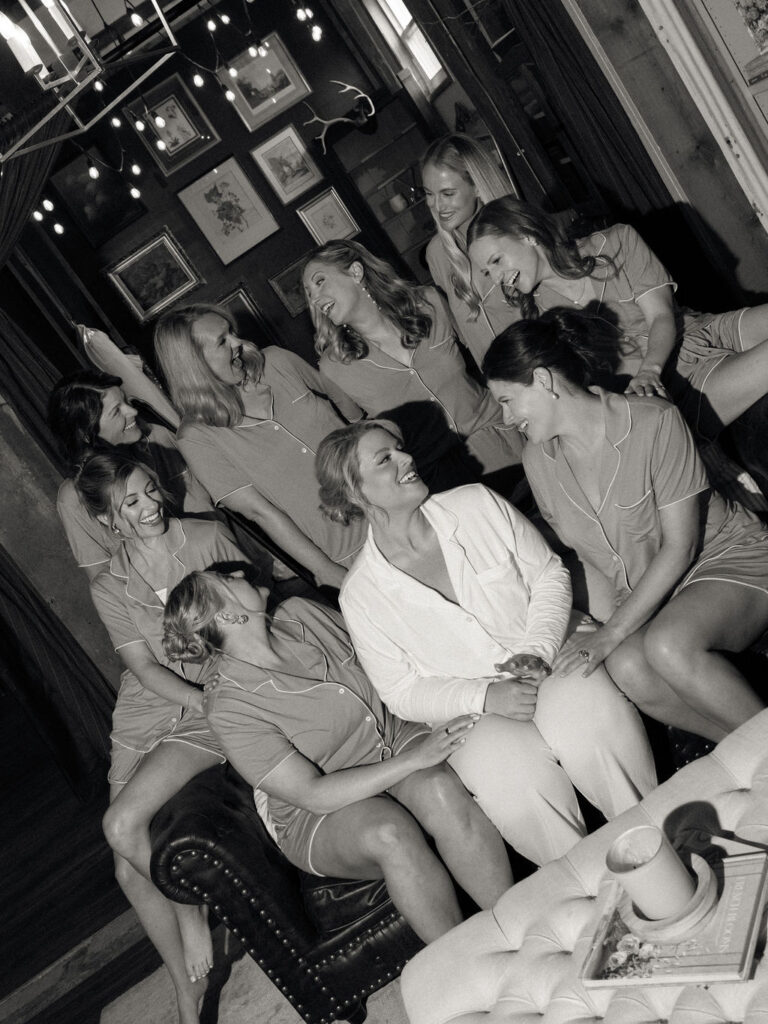 Black and white flash photo of the bride and her bridesmaids in The She Shed at The Millhaven