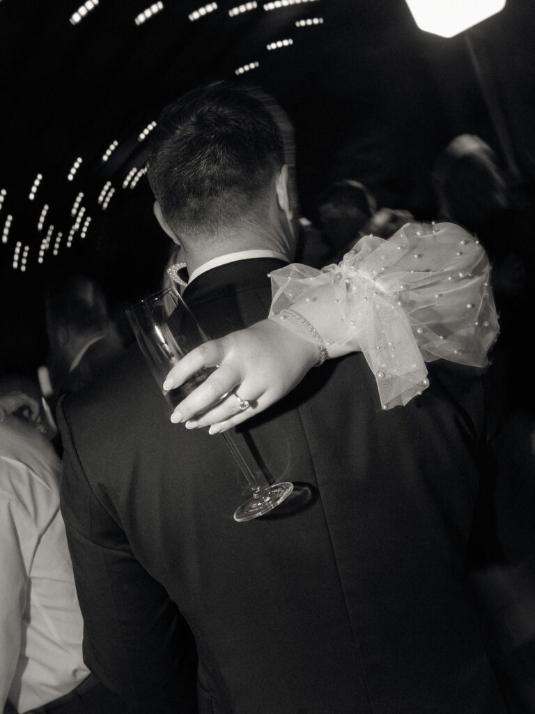Bride and groom hugging during the reception