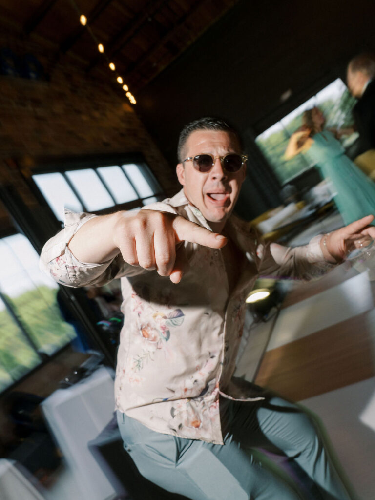 Guest dancing during a reception at The Pickle Factory at The Millhaven