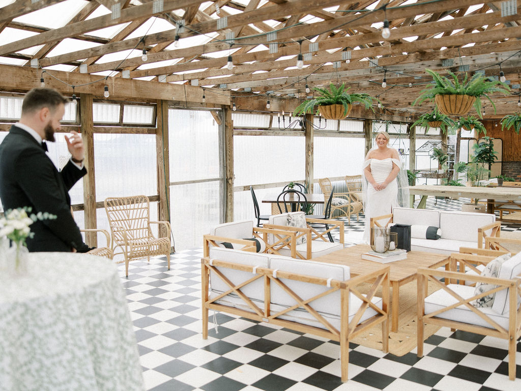 Bride sharing a first look with her groom in The Greenhouse at The Millhaven