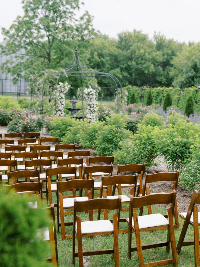 An outdoor wedding ceremony in the gardens at The Millhaven