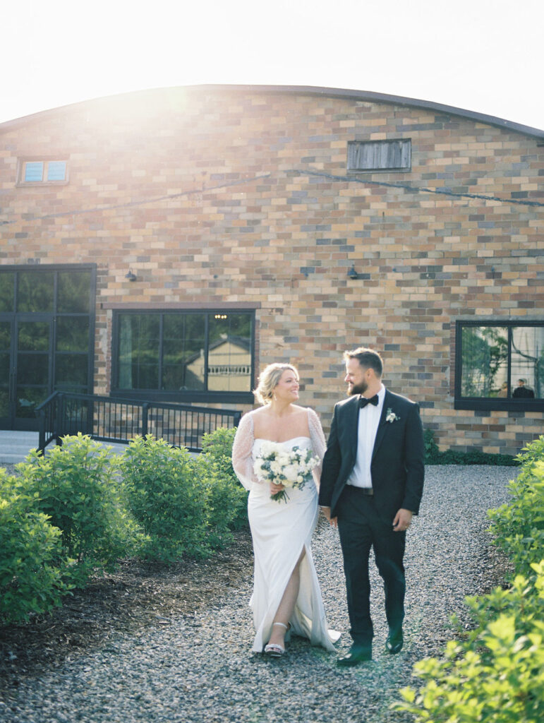 Outdoor golden hour bride and grooms portraits in the garden at The Millhaven in Marshall, Michigan on film