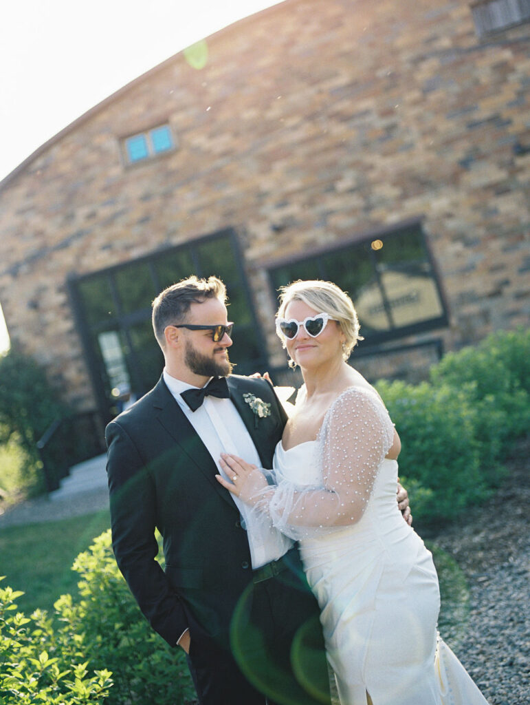 Outdoor golden hour bride and grooms portraits in the garden at The Millhaven in Marshall, Michigan on film