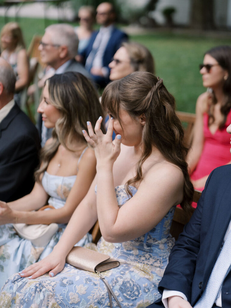 Guests getting emotional during the outdoor ceremony