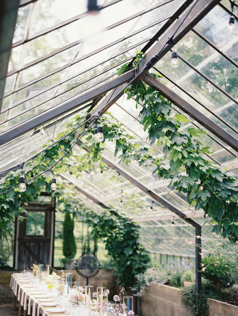 Film photo of a greenhouse wedding reception at Glass House Community