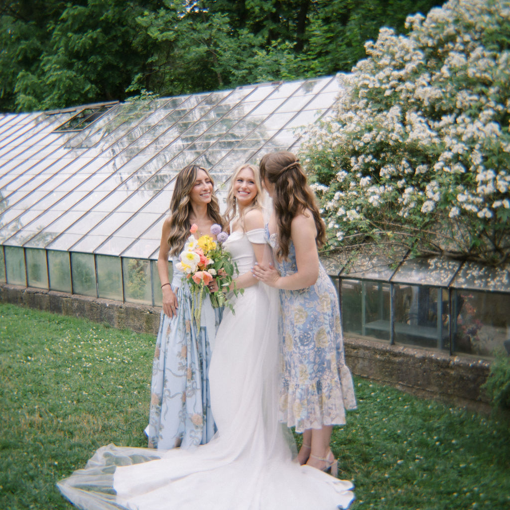 Bride posing with bridesmaids