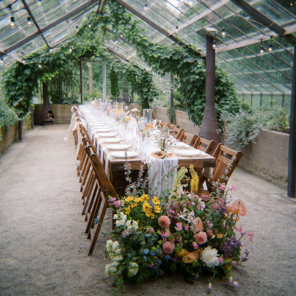Glass House Community wedding reception in the greenhouse