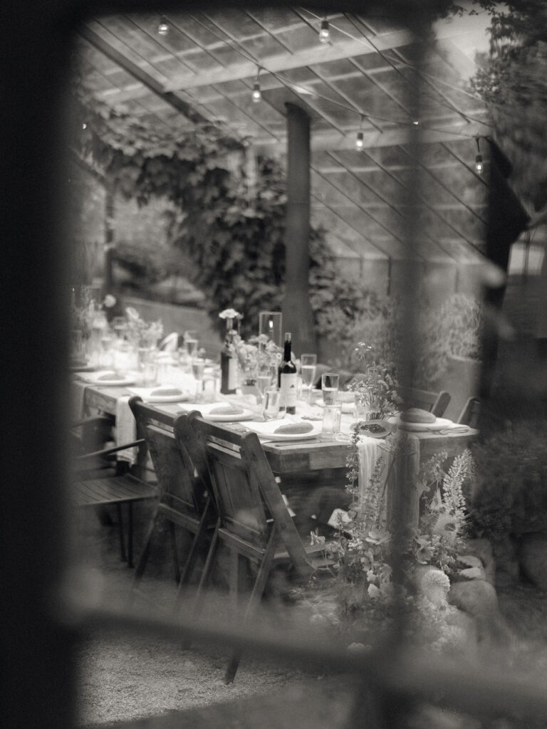 Glass House Community wedding reception detail shot through the glass door