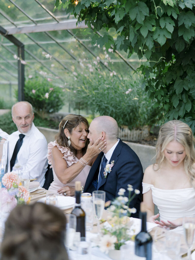 Groom and his mother sharing a moment