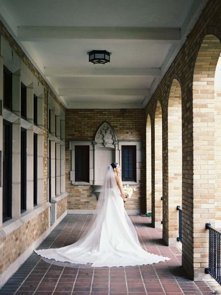 Bride posing for her Saint Mary's Notre Dame wedding photos on film