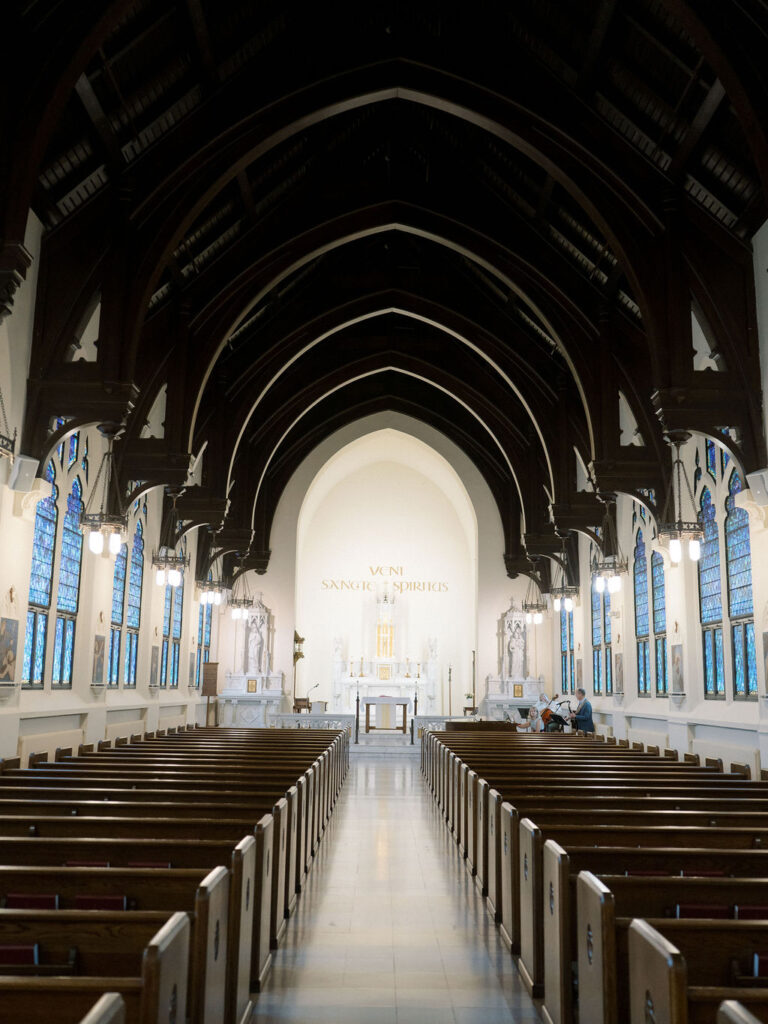 Interior view of the Church of Our Lady of Loretto with arched wood ceilings and marble altar at Saint Mary’s College – Cynthia Mae Photo.