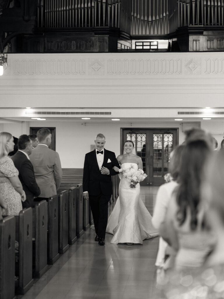 Bride walking down the aisle with her father inside Church of Our Lady of Loretto at Saint Mary’s Notre Dame wedding – Cynthia Mae Photo.