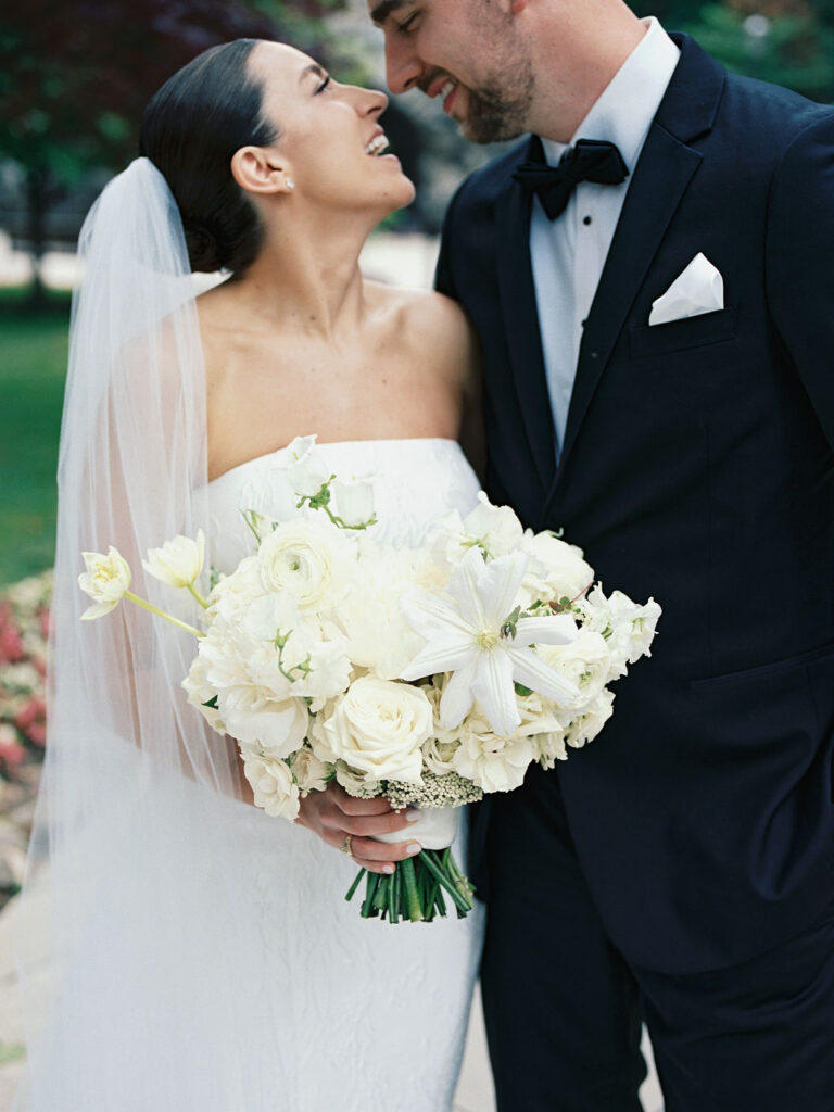 Close up film photo of a bride and groom smiling at each other for their Saint Mary's Notre Dame wedding portraits