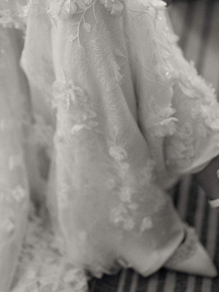  Close up detail shot of the brides wedding dress and shoes