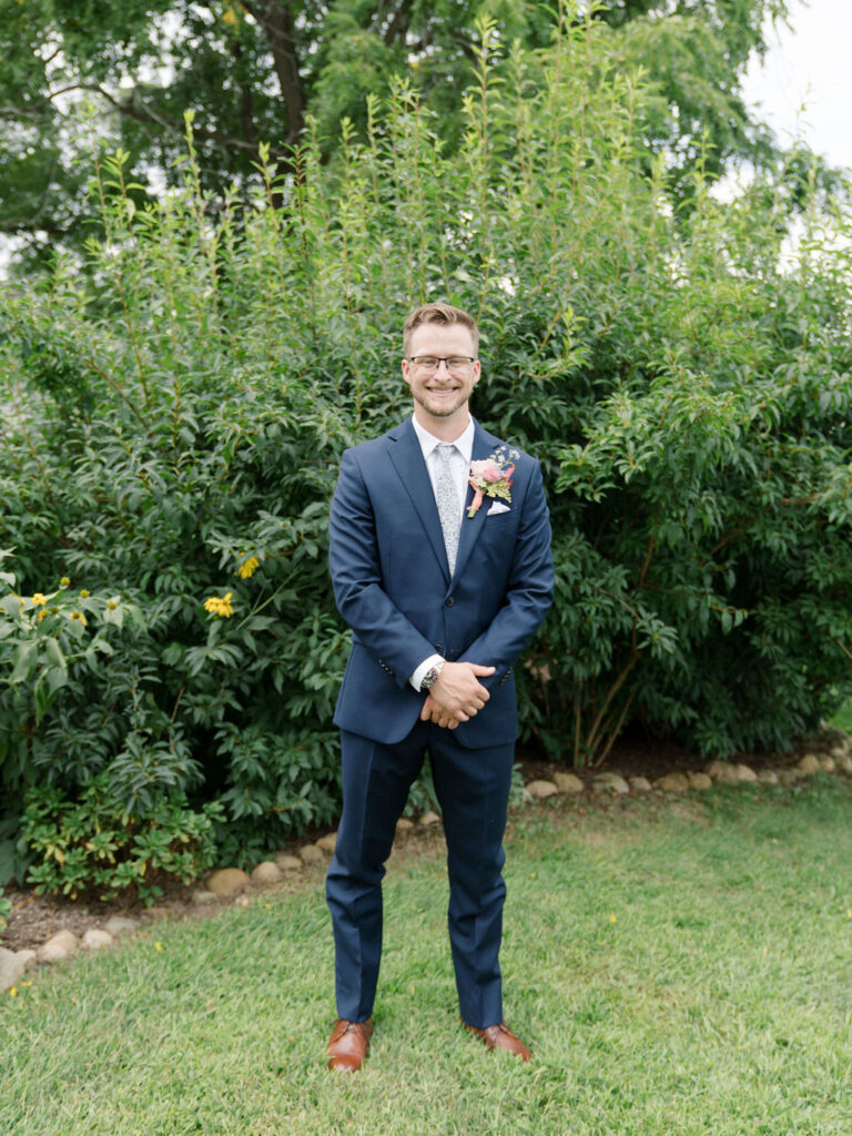 Outdoor grooms portrait at Of The Land in Marshall, Michigan