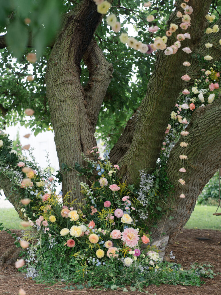 Floral installation gathered at the base of the Mulberry tree for the ceremony.