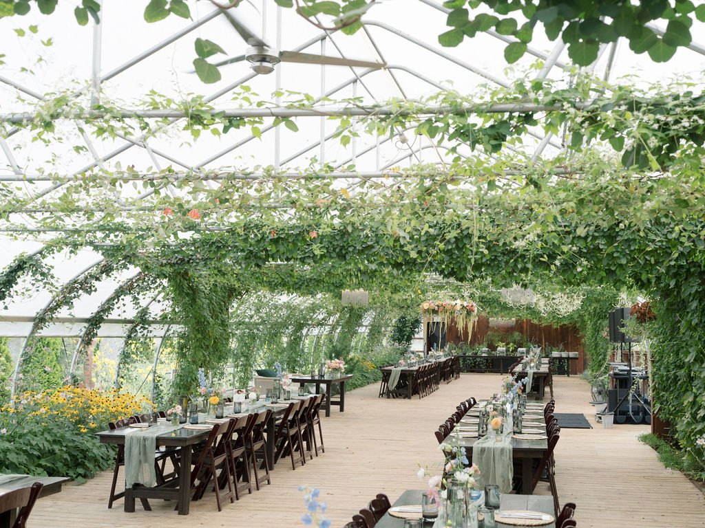 An indoor Of The Land wedding reception in the Greenhouse