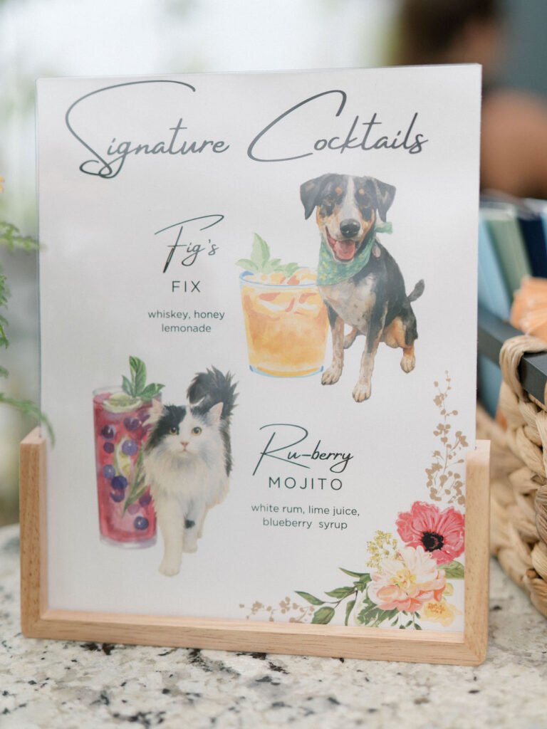 Signature cocktail menu featuring the couple’s pets with illustrated drink options.