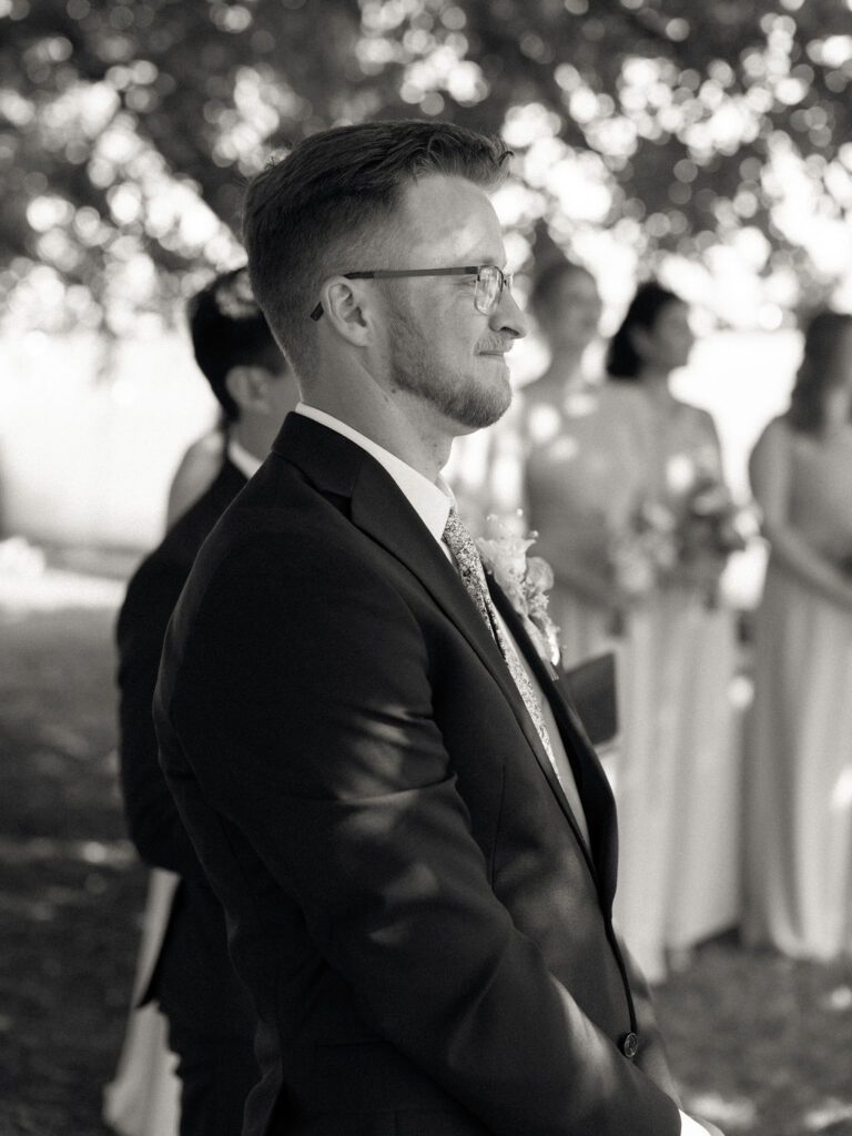 Groom waiting beneath the Mulberry tree as the ceremony begins.