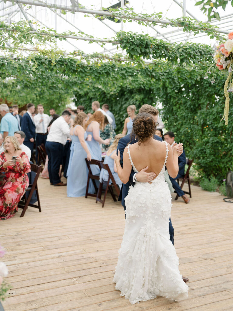 Bride and groom dancing during their reception in The Greenhouse.