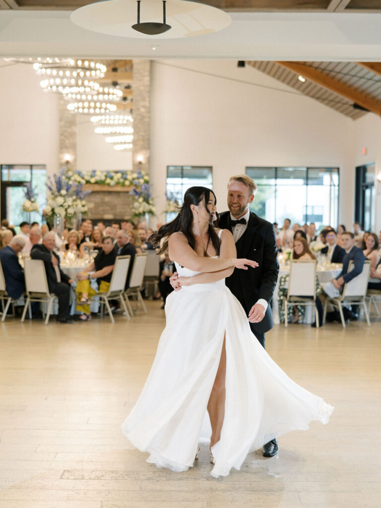 Bride and groom sharing a first dance during their Bay Pointe Woods wedding reception.