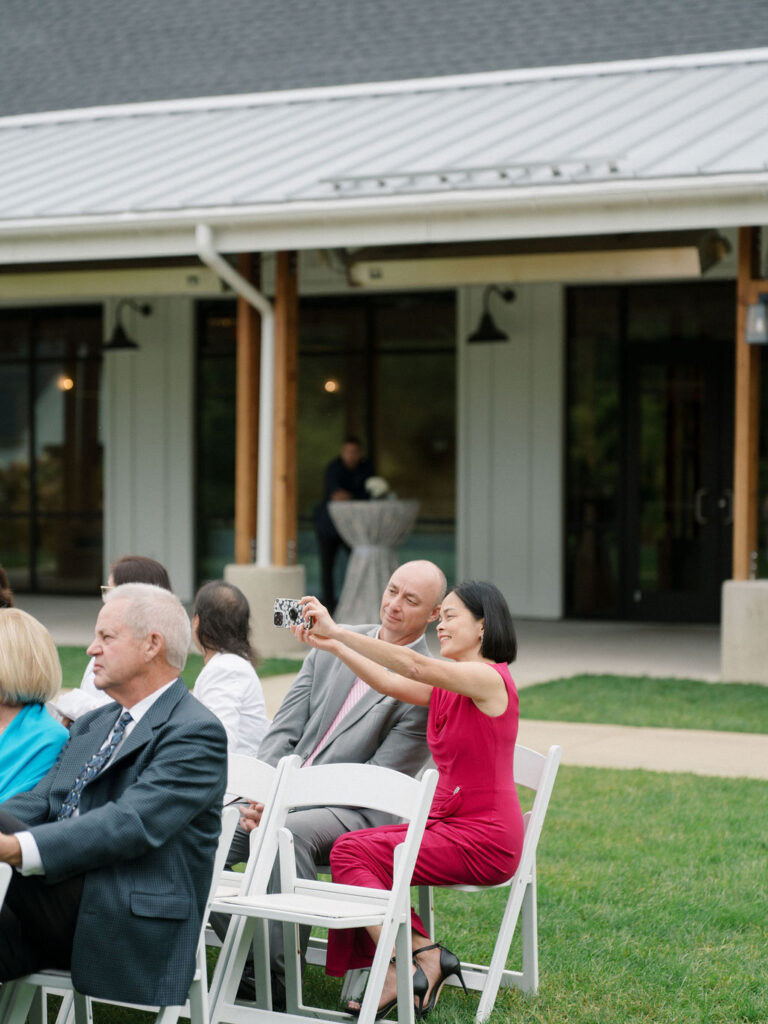 Guests taking as photo as they wait for the ceremony to start.