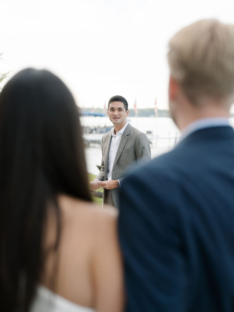 Guest giving a speech during a Bay Pointe Woods wedding rehearsal.