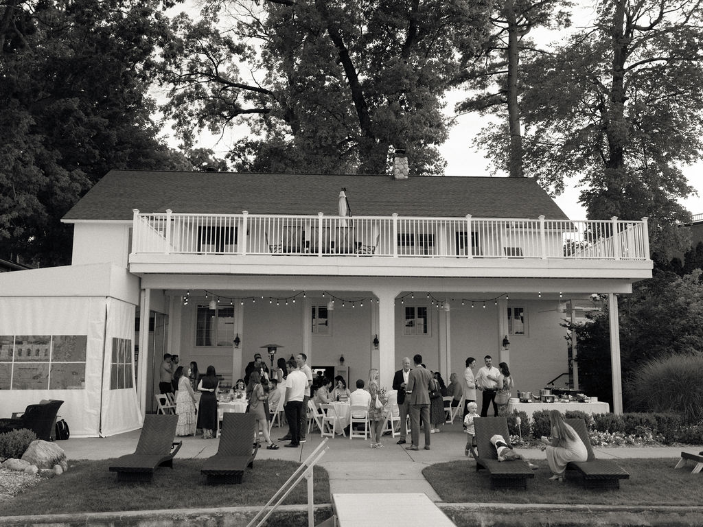 Black and white wide view of Lakefront Pavilion space during a Bay Pointe Woods wedding weekend rehearsal. 