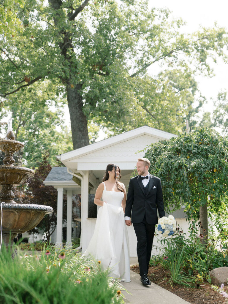 Outdoor bride and grooms portraits at Bay Pointe Woods in Shelbyville, MI.