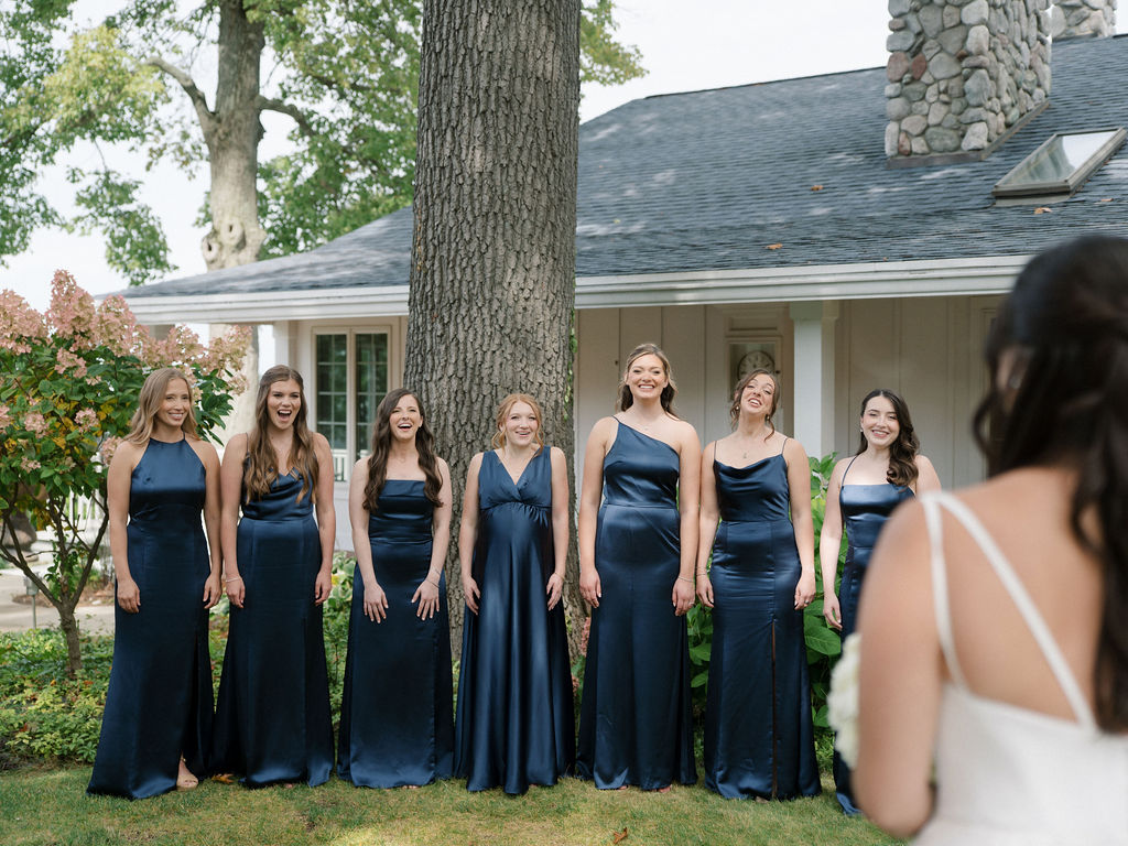 Bride sharing a first look with her bridesmaids.