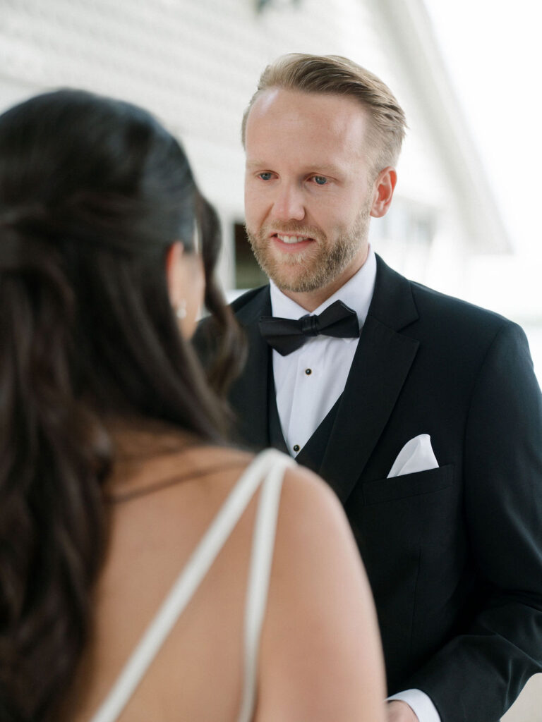 Groom getting emotional as he sees his bride during their first look.